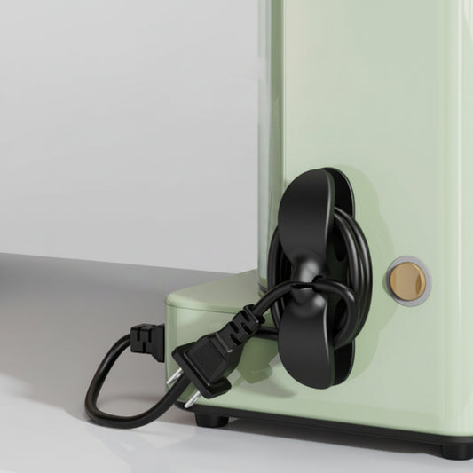 Black appliance cable organizer attached to a kitchen air fryer for neat cord management