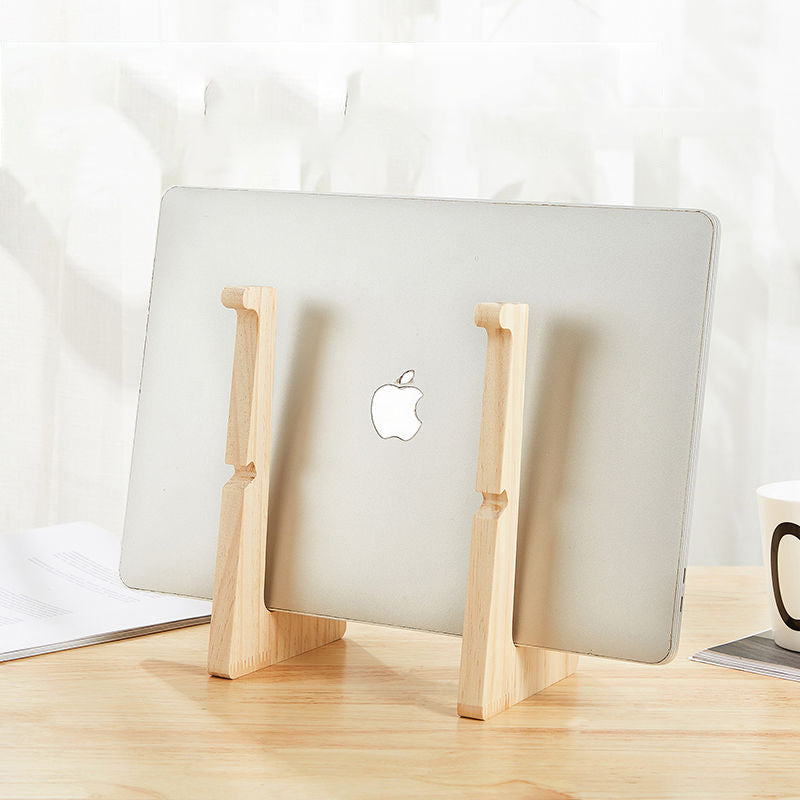 Artisan wooden laptop stand supporting a 13-inch MacBook on a minimalist wooden desk