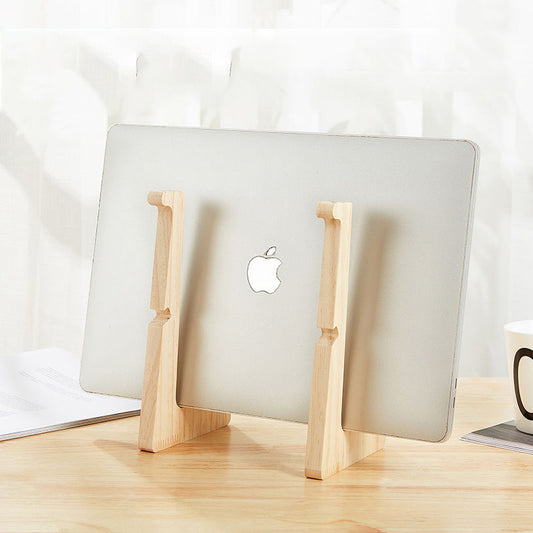 Artisan wooden laptop stand supporting a 13-inch MacBook on a minimalist wooden desk