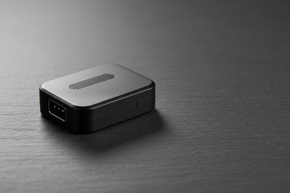 GPS motorcycle tracker CJ780 compact black ABS device on dark slate surface with soft studio lighting