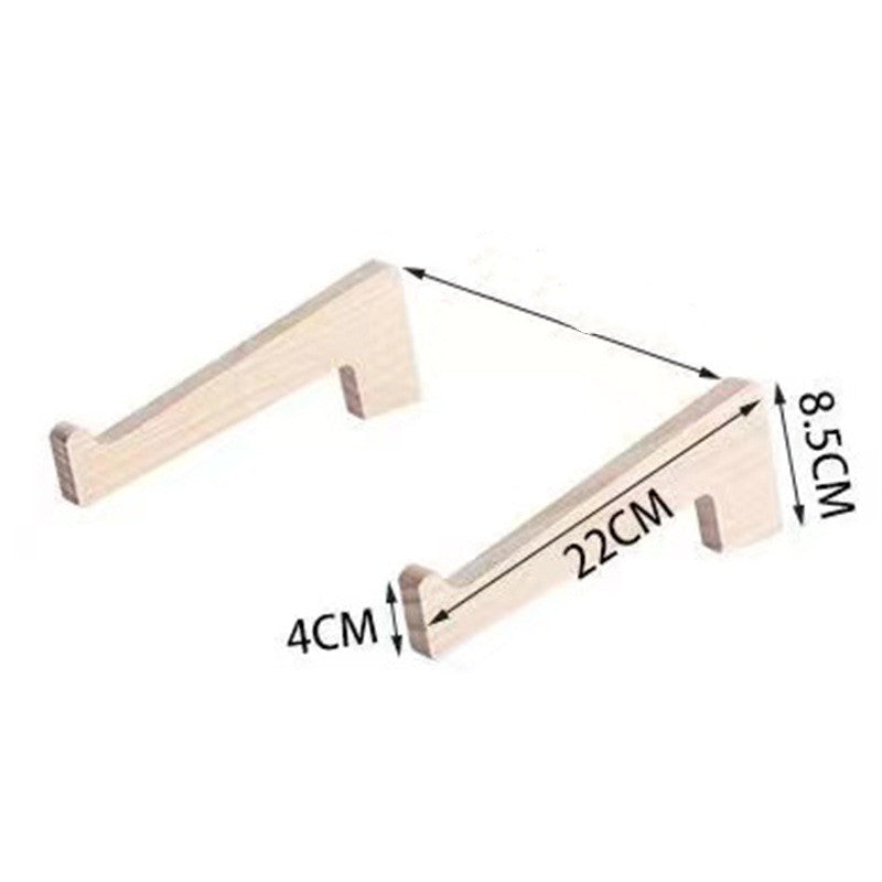 Wooden laptop holder used in a productive office setting to elevate screen height