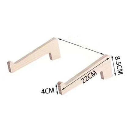 Wooden laptop holder used in a productive office setting to elevate screen height