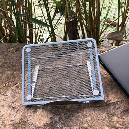 A laptop resting securely on the stable and colorful iron laptop stand